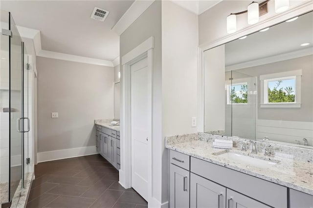 full bathroom featuring visible vents, ornamental molding, a shower stall, vanity, and baseboards