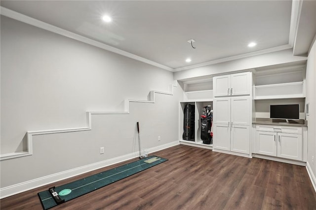 exercise room featuring baseboards, ornamental molding, dark wood-style flooring, and recessed lighting