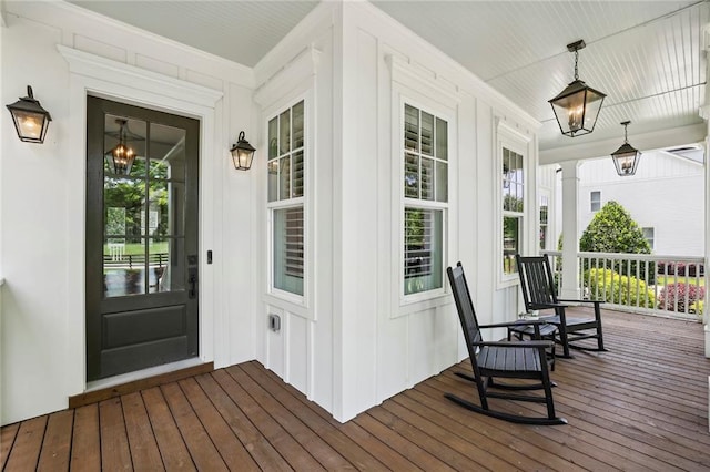 view of exterior entry with a porch