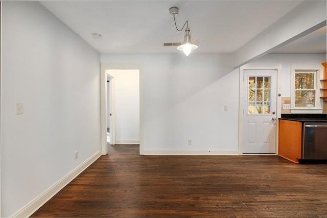 unfurnished dining area featuring dark hardwood / wood-style flooring