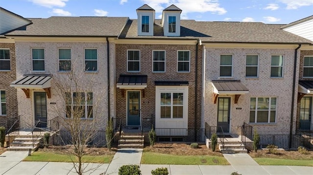 view of property featuring brick siding