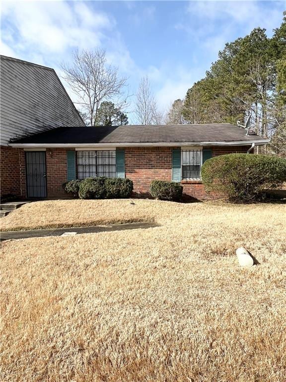 view of side of property with a yard