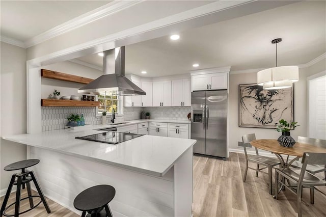 1282 Westridge Rd SW, Atlanta, GA 30311 - kitchen featuring open shelves, a peninsula, island exhaust hood, a sink, and stainless steel fridge