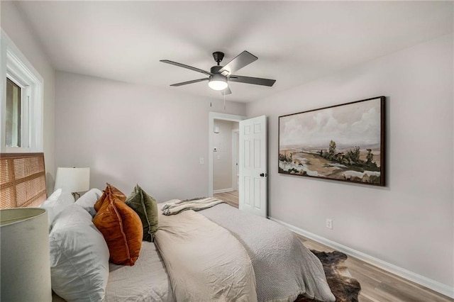1282 Westridge Rd SW, Atlanta, GA 30311 - bedroom featuring baseboards, wood finished floors, and a ceiling fan