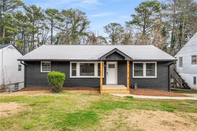 1282 Westridge Rd SW, Atlanta, GA 30311 - view of front of property with brick siding, a shingled roof, and a front yard