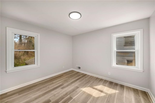 1282 Westridge Rd SW, Atlanta, GA 30311 - unfurnished room featuring wood finished floors, baseboards, and visible vents
