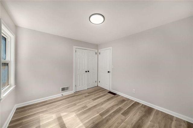 1282 Westridge Rd SW, Atlanta, GA 30311 - empty room featuring light wood-type flooring, visible vents, and baseboards