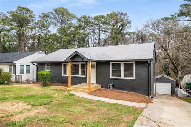 1282 Westridge Rd SW, Atlanta, GA 30311 - ranch-style house with a detached garage, an outdoor structure, a front yard, concrete driveway, and brick siding