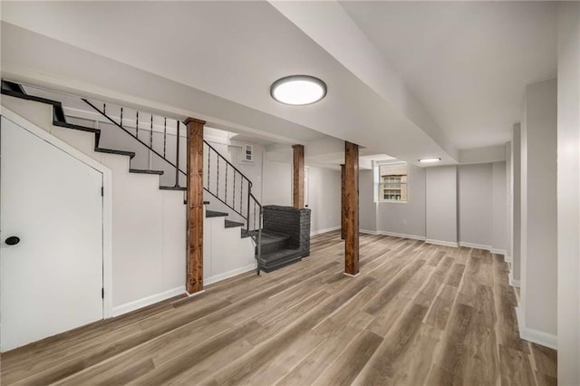 1282 Westridge Rd SW, Atlanta, GA 30311 - below grade area featuring stairway, baseboards, and wood finished floors