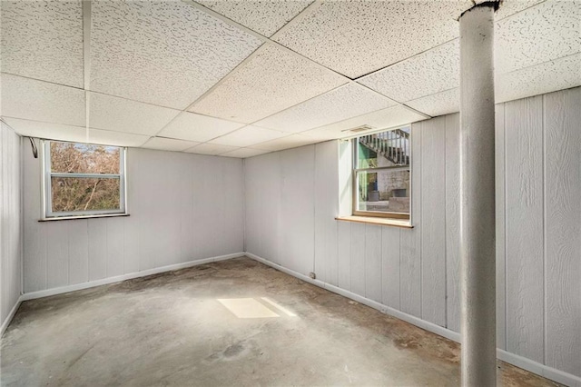 1282 Westridge Rd SW, Atlanta, GA 30311 - basement featuring wooden walls, baseboards, and a drop ceiling
