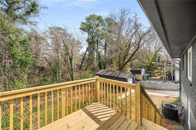 1282 Westridge Rd SW, Atlanta, GA 30311 - deck featuring a storage unit and an outdoor structure