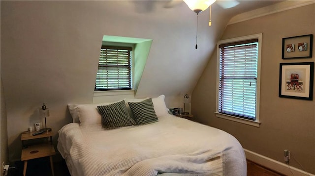 1171 Goodwin Rd NE, Atlanta, GA 30324 - bedroom featuring wood finished floors, vaulted ceiling, and a ceiling fan