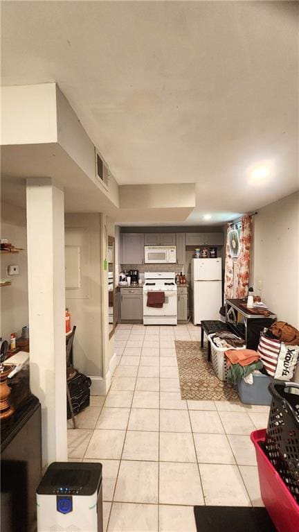 1171 Goodwin Rd NE, Atlanta, GA 30324 - kitchen with white appliances, light tile patterned flooring, and gray cabinets