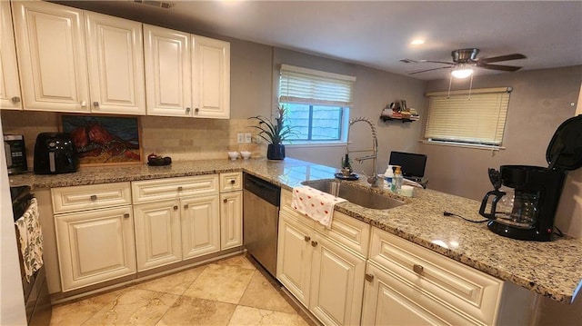 1171 Goodwin Rd NE, Atlanta, GA 30324 - kitchen featuring stainless steel dishwasher, ceiling fan, light stone countertops, tasteful backsplash, and a peninsula