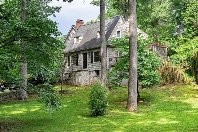 1171 Goodwin Rd NE, Atlanta, GA 30324 - view of side of home with a chimney and a yard