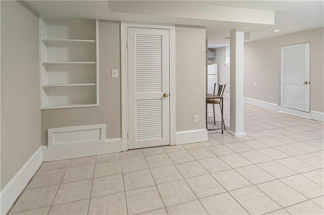 1171 Goodwin Rd NE, Atlanta, GA 30324 - empty room with light tile patterned floors and recessed lighting