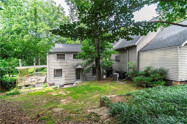 1171 Goodwin Rd NE, Atlanta, GA 30324 - back of property with a deck and roof with shingles