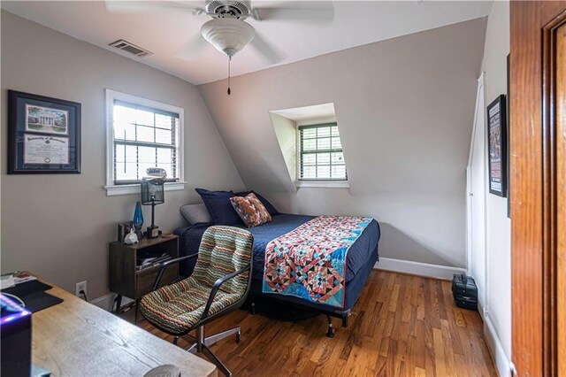 1171 Goodwin Rd NE, Atlanta, GA 30324 - bedroom featuring wood finished floors, vaulted ceiling, and a ceiling fan