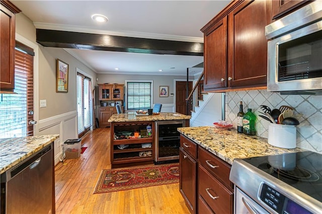 1171 Goodwin Rd NE, Atlanta, GA 30324 - kitchen with stainless steel appliances, beverage cooler, light wood-style floors, crown molding, and tasteful backsplash