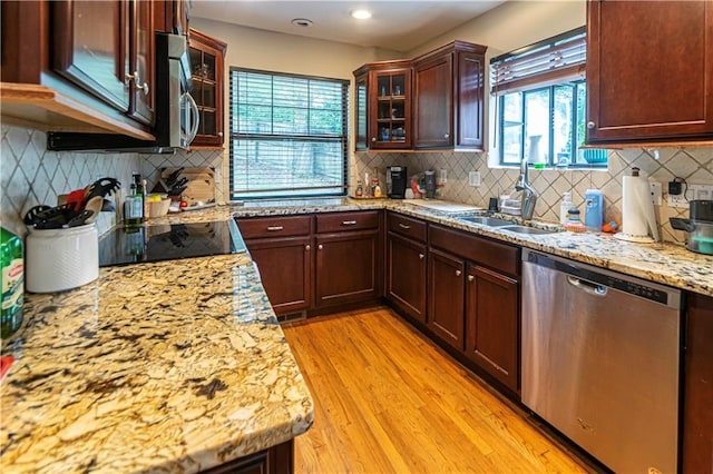 1171 Goodwin Rd NE, Atlanta, GA 30324 - kitchen featuring stainless steel appliances, plenty of natural light, light wood-style flooring, decorative backsplash, and recessed lighting