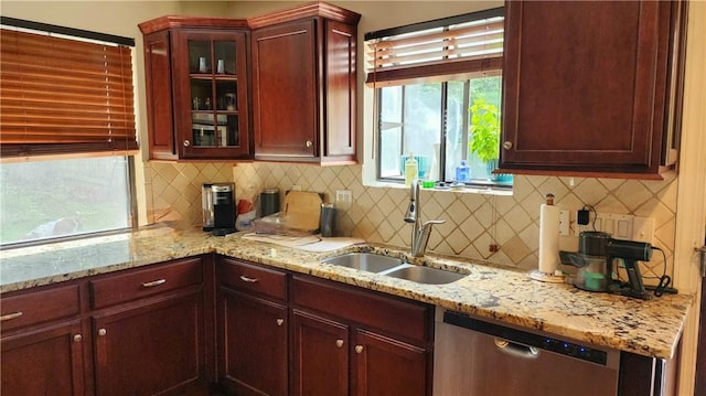 1171 Goodwin Rd NE, Atlanta, GA 30324 - kitchen featuring dishwasher, glass insert cabinets, backsplash, and light stone counters
