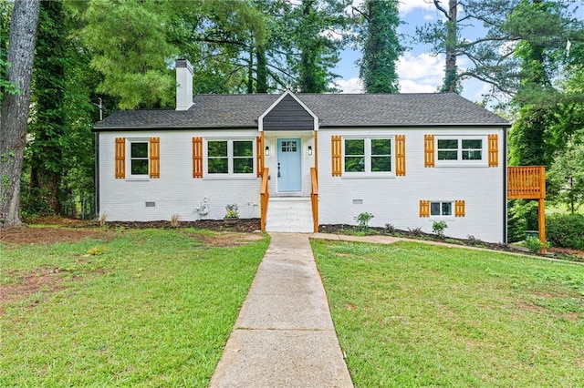 1995 Venetian Dr SW, Atlanta, GA 30311 - view of front of home with a chimney, a front yard, crawl space, and brick siding