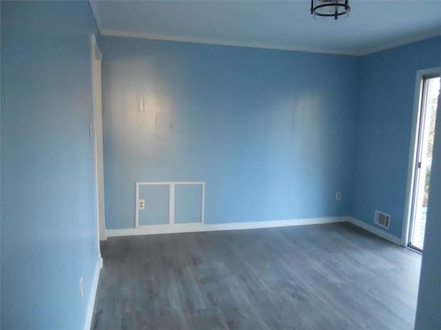 spare room with dark wood-type flooring