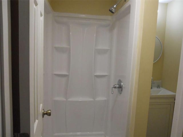 bathroom featuring vanity and walk in shower