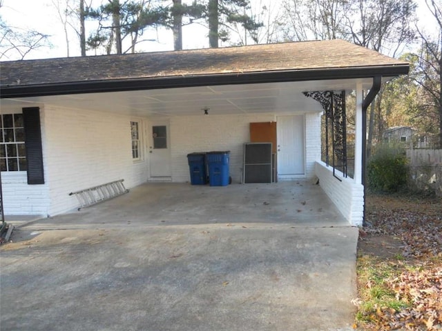 view of parking / parking lot featuring a carport