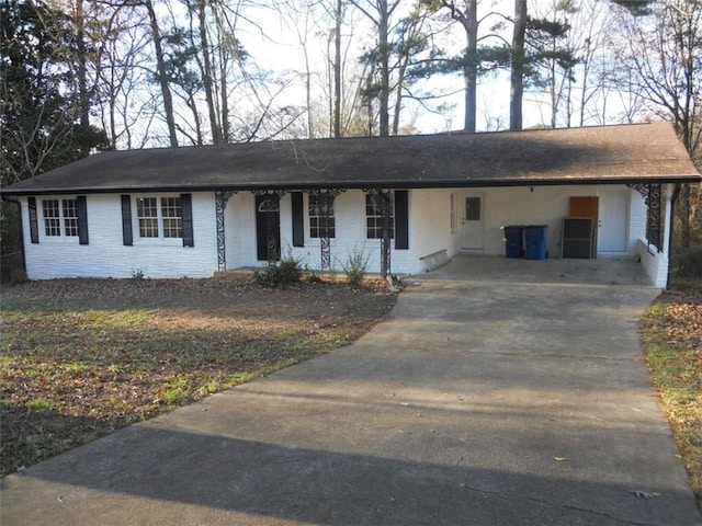 ranch-style house with a carport