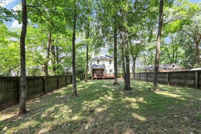 view of yard with a wooden deck