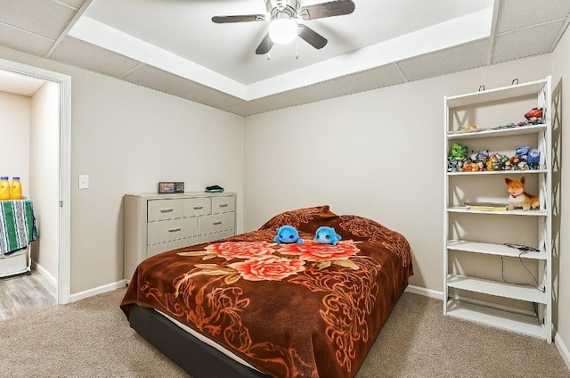 bedroom with carpet floors, baseboards, and ceiling fan
