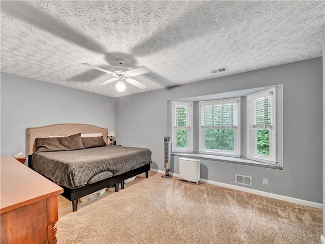 555 Creekwood Xing, Roswell, GA 30076 - bedroom featuring visible vents, a ceiling fan, baseboards, and light carpet