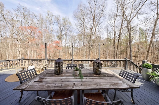 wooden deck with outdoor dining area