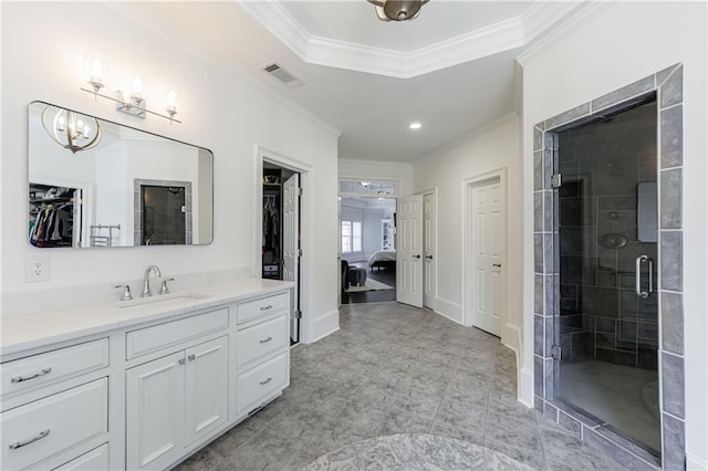 bathroom featuring ornamental molding, a stall shower, a notable chandelier, and vanity