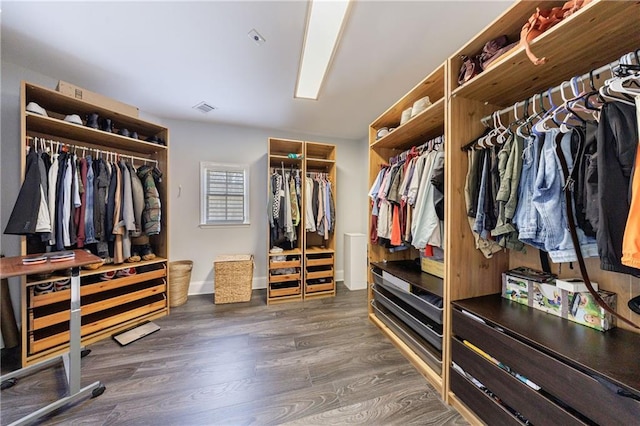 walk in closet featuring wood finished floors and visible vents