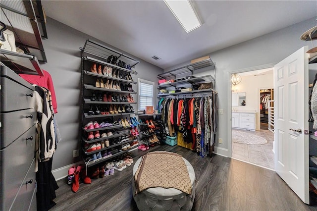 spacious closet with visible vents and wood finished floors