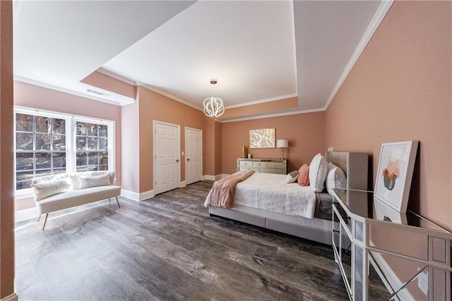 bedroom featuring baseboards, visible vents, ornamental molding, and wood finished floors