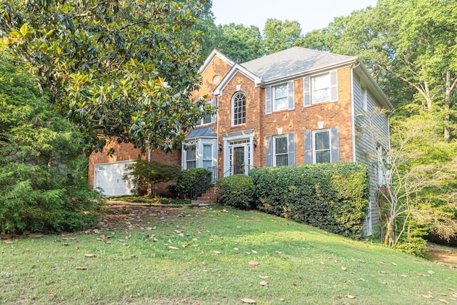 1253 Rivermark Ct, Lawrenceville, GA 30043 - colonial-style house featuring a front yard, brick siding, and a garage