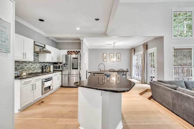 1253 Rivermark Ct, Lawrenceville, GA 30043 - kitchen featuring appliances with stainless steel finishes, a sink, healthy amount of natural light, recessed lighting, and ornamental molding