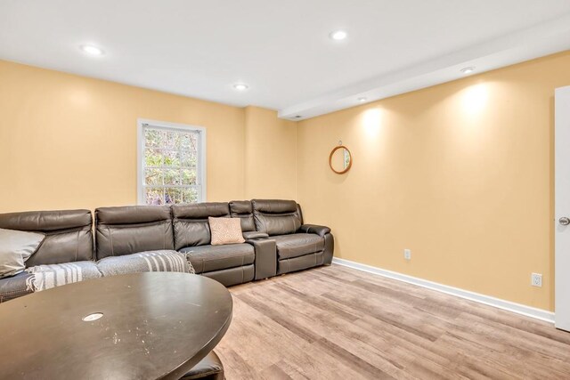 1253 Rivermark Ct, Lawrenceville, GA 30043 - living area featuring light wood finished floors, recessed lighting, and baseboards