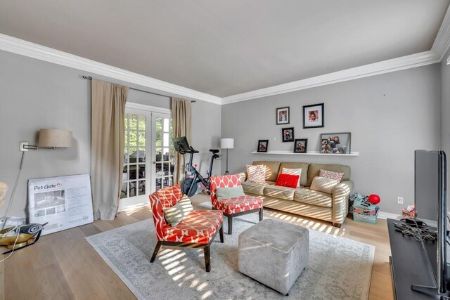 1253 Rivermark Ct, Lawrenceville, GA 30043 - living area with ornamental molding, heating unit, french doors, wood finished floors, and baseboards