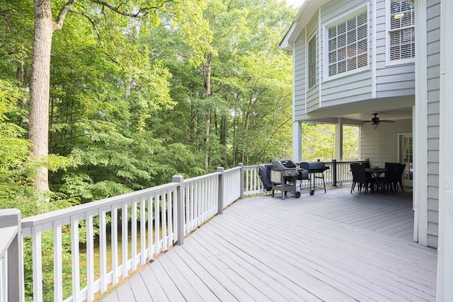 1253 Rivermark Ct, Lawrenceville, GA 30043 - deck with outdoor dining area, ceiling fan, and a grill