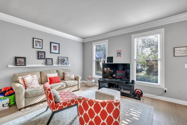 1253 Rivermark Ct, Lawrenceville, GA 30043 - living room featuring crown molding, wood finished floors, and baseboards