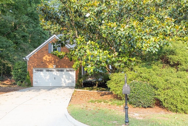 1253 Rivermark Ct, Lawrenceville, GA 30043 - view of front of property with concrete driveway, brick siding, and an attached garage