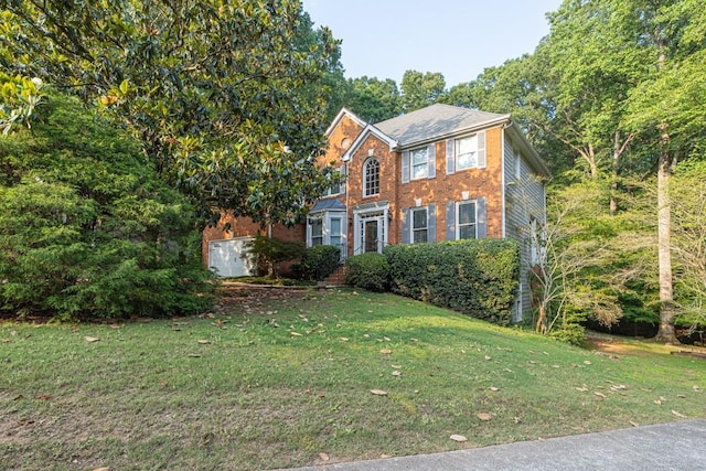 1253 Rivermark Ct, Lawrenceville, GA 30043 - colonial-style house featuring a front yard and brick siding