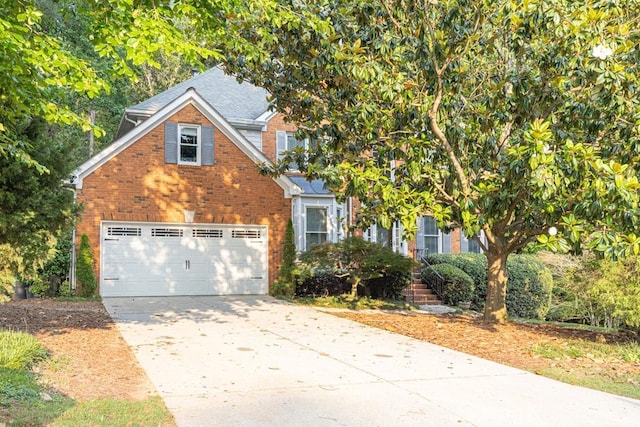 1253 Rivermark Ct, Lawrenceville, GA 30043 - view of front of home featuring brick siding, concrete driveway, an attached garage, and roof with shingles