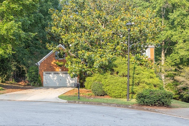 1253 Rivermark Ct, Lawrenceville, GA 30043 - view of front of home with a garage and concrete driveway