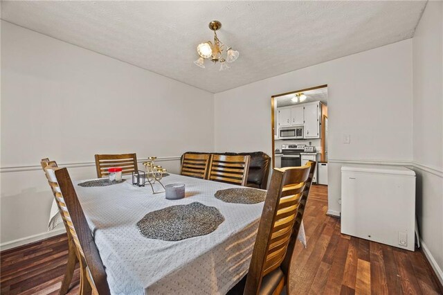 1230 Brook Meadow Ct, Lawrenceville, GA 30045 - dining area with a chandelier, wood finished floors, and baseboards