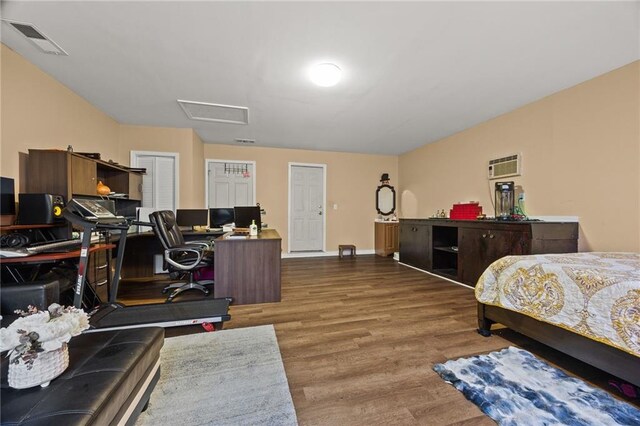 1230 Brook Meadow Ct, Lawrenceville, GA 30045 - bedroom featuring wood finished floors, attic access, a desk, and a wall mounted air conditioner